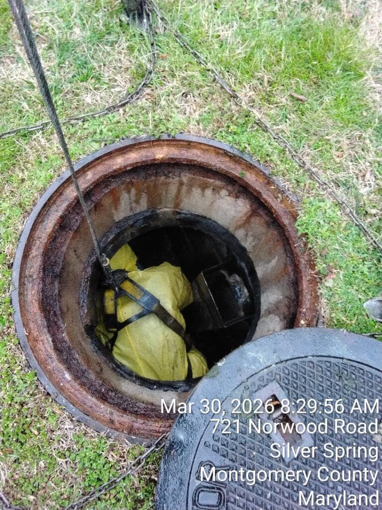 a magnolia companies tech during a grease trap cleaning job
